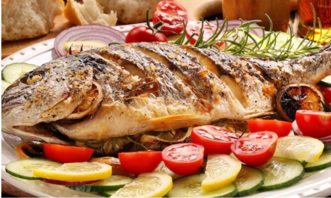 Smoked fish and seafood platter with salmon, shrimp, and oysters